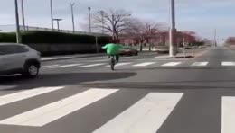 BLACK GUY RIDES HIS BIKE INTO ONCOMING TRAFFIC WITH CARS HONKING
